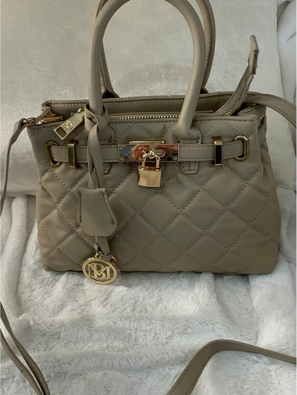 Beige Quilted Small Handbag with Gold Hardware and Lock